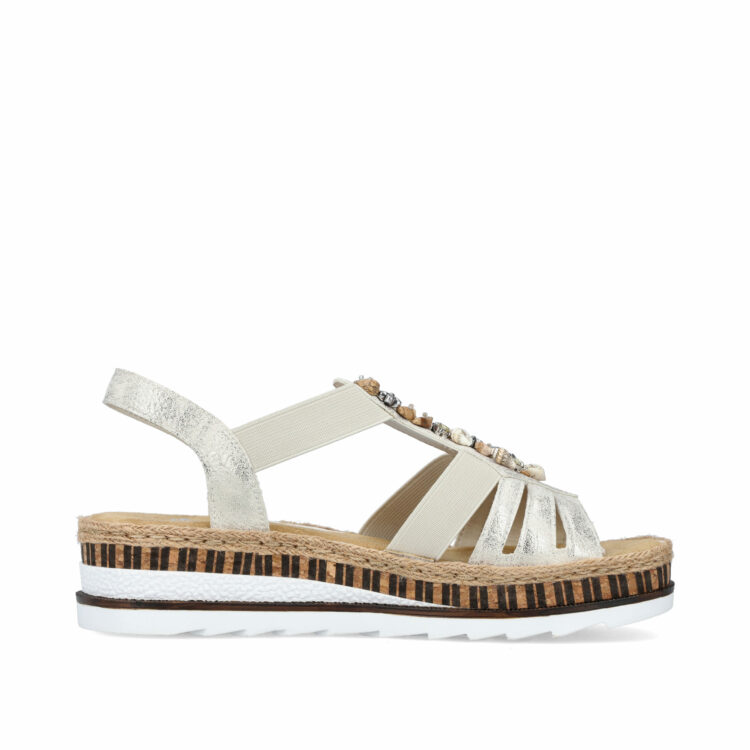 Sandales beiges pour femme de la marque Rieker. Référence : V7949-90 Beige gold. Disponible chez Chauss'Family magasin de chaussures à Issoire.
