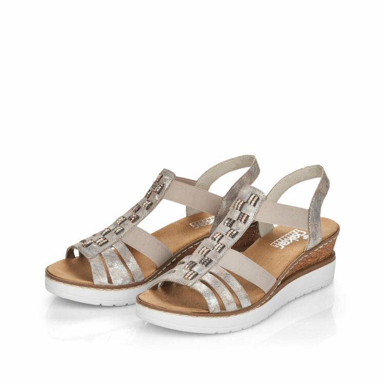 Sandales compensées pour femme de la marque Rieker. Référence : V3822-90 Rose metallic. Disponible chez Chauss'Family magasin de chaussures à Issoire.