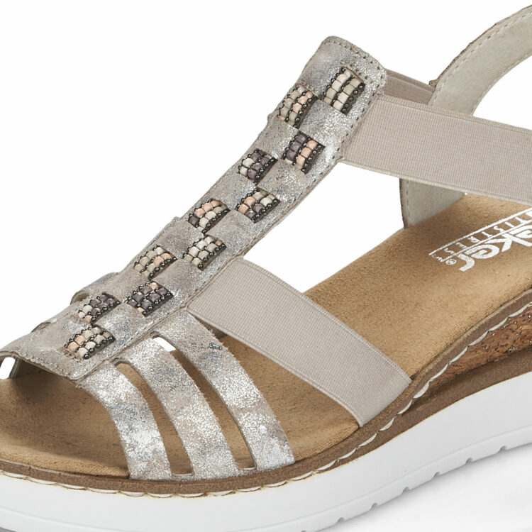 Sandales compensées pour femme de la marque Rieker. Référence : V3822-90 Rose metallic. Disponible chez Chauss'Family magasin de chaussures à Issoire.