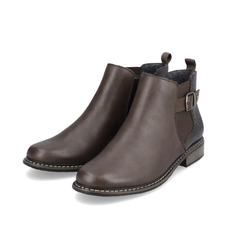 Bottines marron pour femme marque Rieker. Référence Z4965-25 Merbau. Disponible chez Chauss'Family magasin de chaussures Issoire.