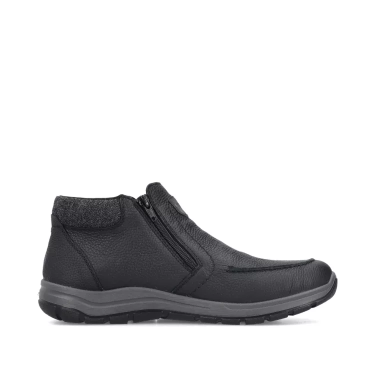 Bottillons noirs fermeture éclair de la marque Rieker. Référence : 03660-00 noir. Disponible chez Chauss'Family magasin de chaussures à Issoire.