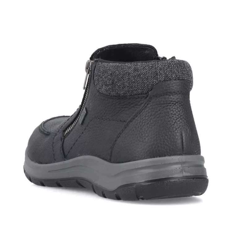 Bottillons noirs fermeture éclair de la marque Rieker. Référence : 03660-00 noir. Disponible chez Chauss'Family magasin de chaussures à Issoire.