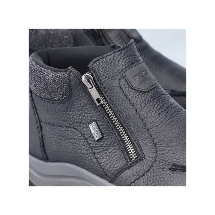 Bottillons noirs fermeture éclair de la marque Rieker. Référence : 03660-00 noir. Disponible chez Chauss'Family magasin de chaussures à Issoire.