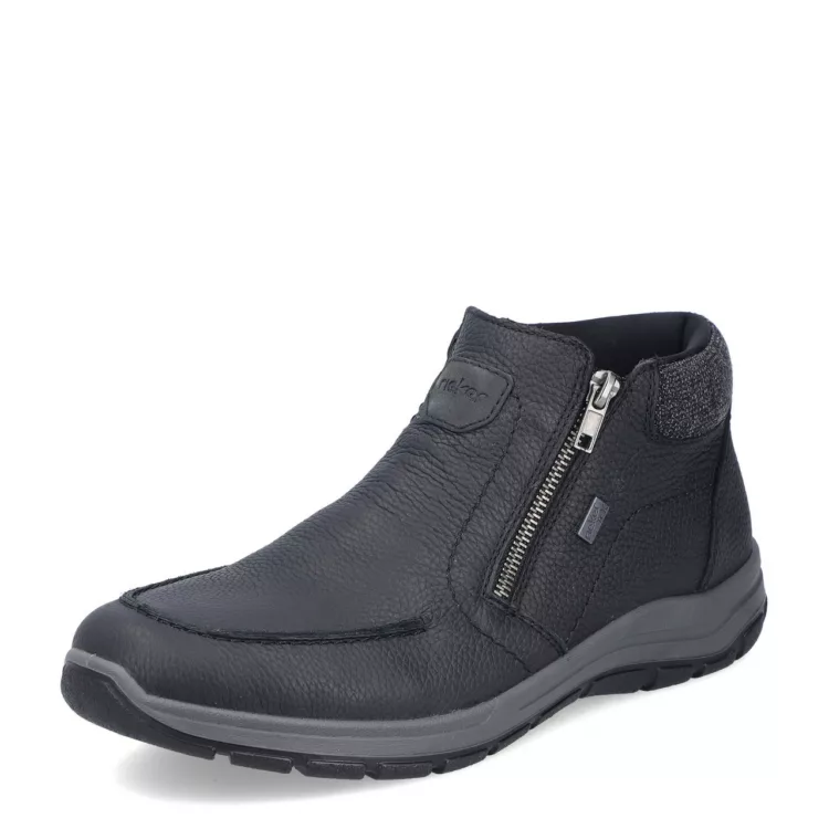 Bottillons noirs fermeture éclair de la marque Rieker. Référence : 03660-00 noir. Disponible chez Chauss'Family magasin de chaussures à Issoire.