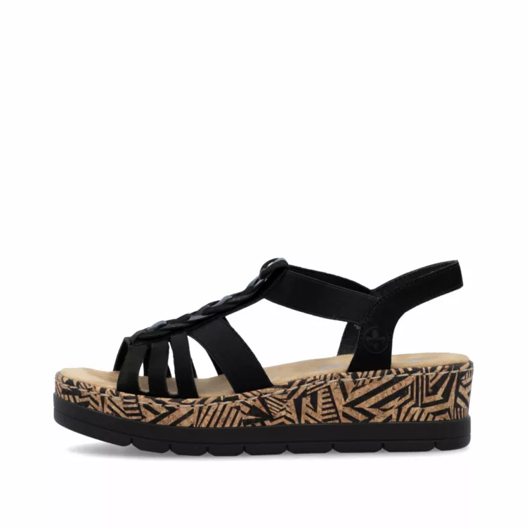 Sandales compensées noires Rieker pour femme. Référence : V3902-00 Schwarz. Disponible chez Chauss'Family magasin de chaussures à Issoire.