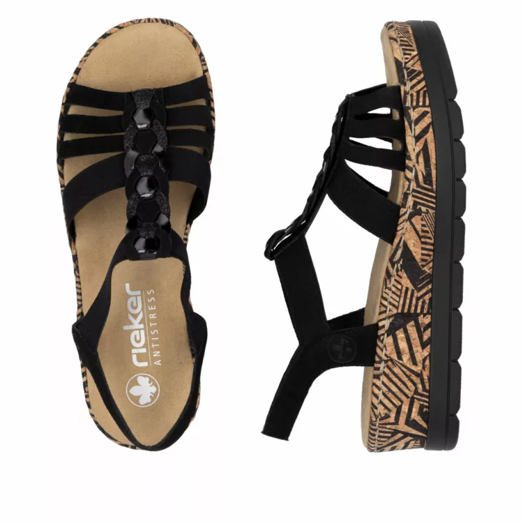 Sandales compensées noires Rieker pour femme. Référence : V3902-00 Schwarz. Disponible chez Chauss'Family magasin de chaussures à Issoire.