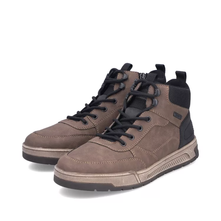 Baskets montantes chaudes marron et noir de la marque Rieker. Référence : 36020- 24 marron. Disponible chez Chauss'Family magasin de chaussures à Issoire.