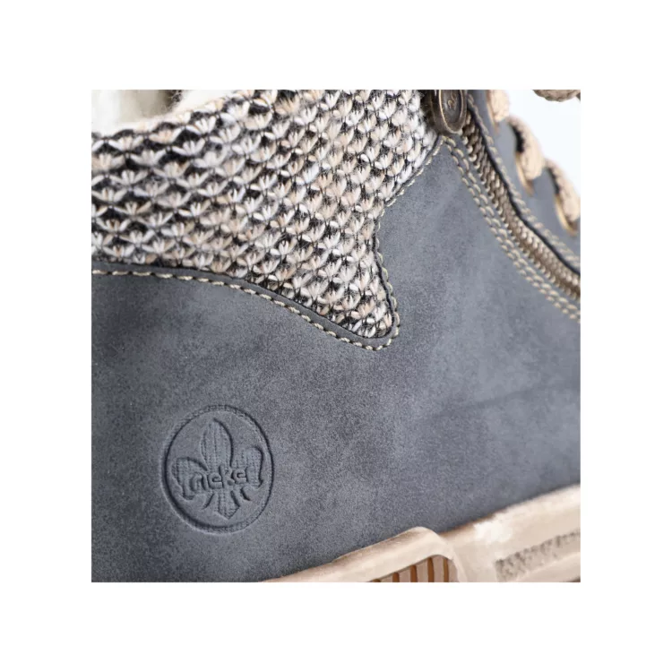 Baskets montantes bleu clair de la marque Rieker pour femme. Référence : N0709-14 Bleu. Disponible chez Chauss'Family magasin de chaussures à Issoire.