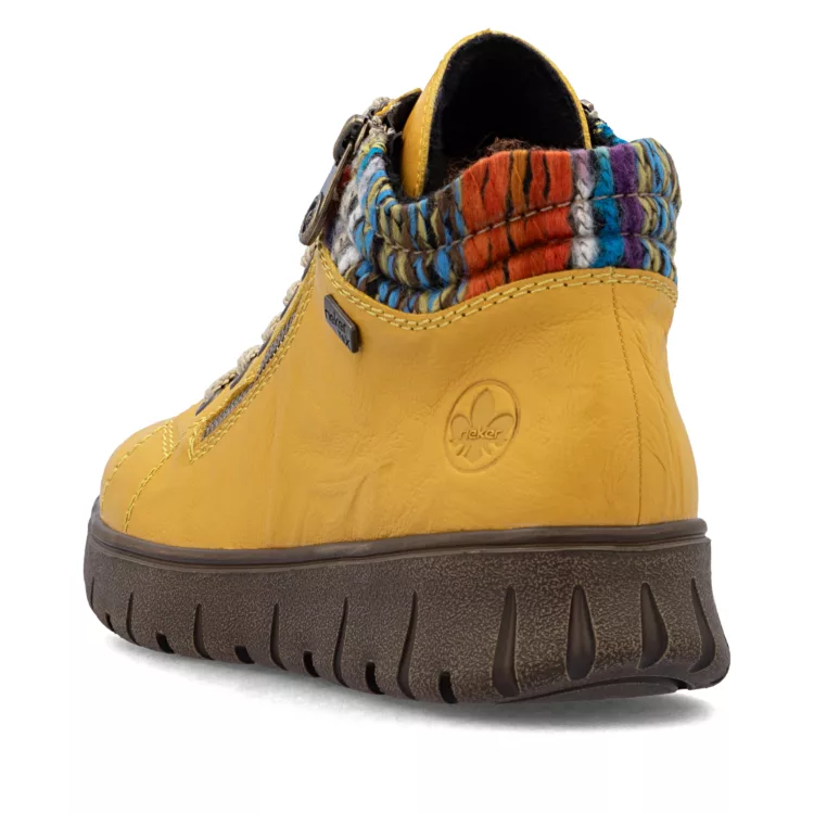 Baskets montantes jaunes de la marque Rieker. Référence : N1305-68 Jaune . Disponible chez Chauss'Family magasin de chaussures à Issoire.