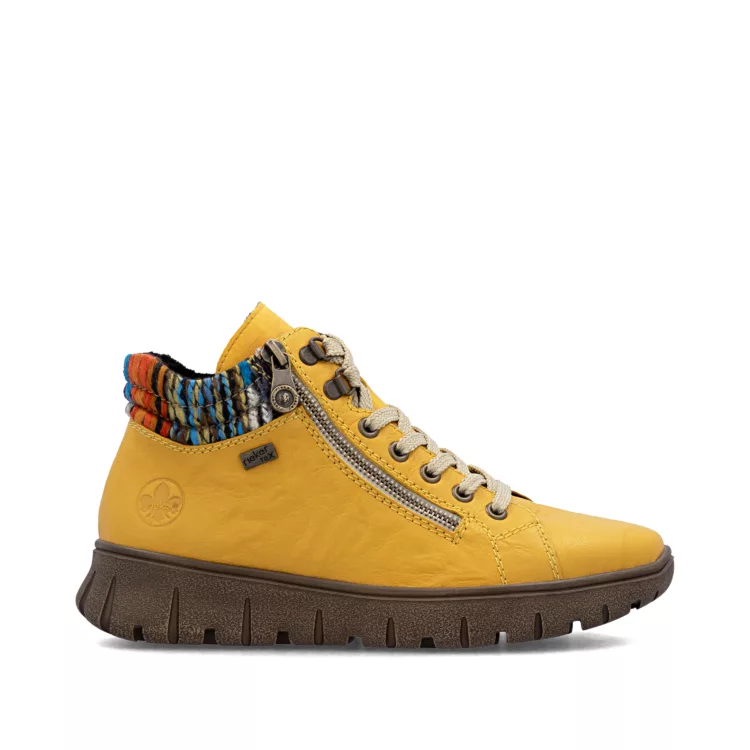 Baskets montantes jaunes de la marque Rieker. Référence : N1305-68 Jaune . Disponible chez Chauss'Family magasin de chaussures à Issoire.