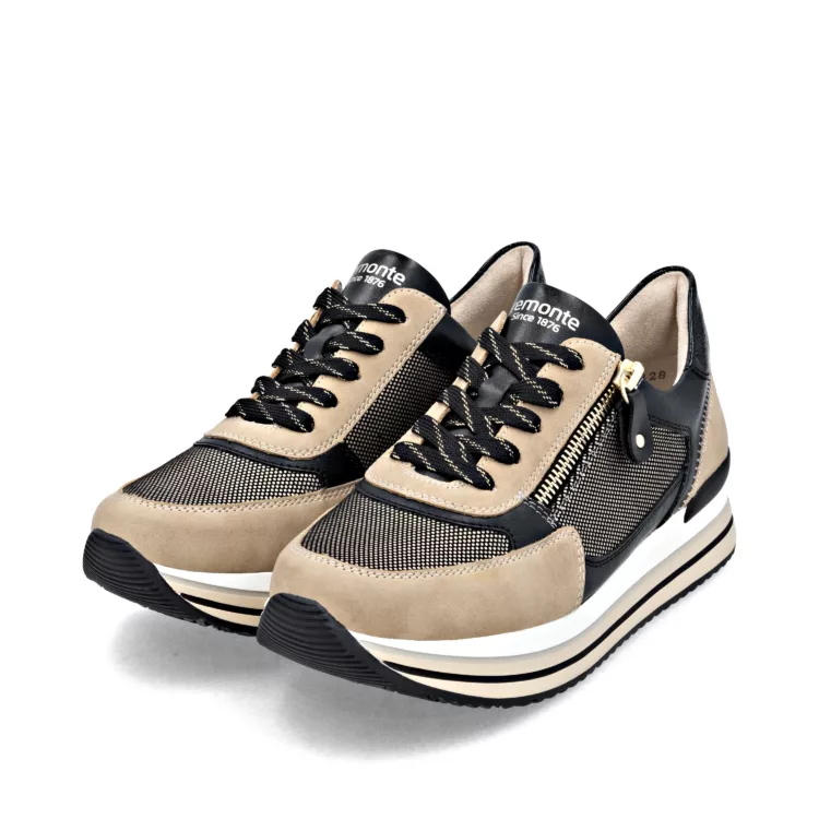 Baskets beige et noire de la marque Remonte pour femme. Référence D1328-04 Beige et Noir. Disponible chez Chauss'Family magasin de chaussures à Issoire.