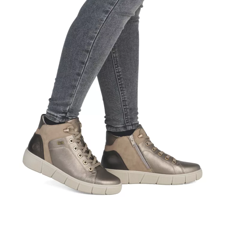Baskets montantes bronze pour femme marque Remonte. Référence D1T77-90 Bronze. Disponible chez Chauss'Family magasin de chaussures à Issoire.