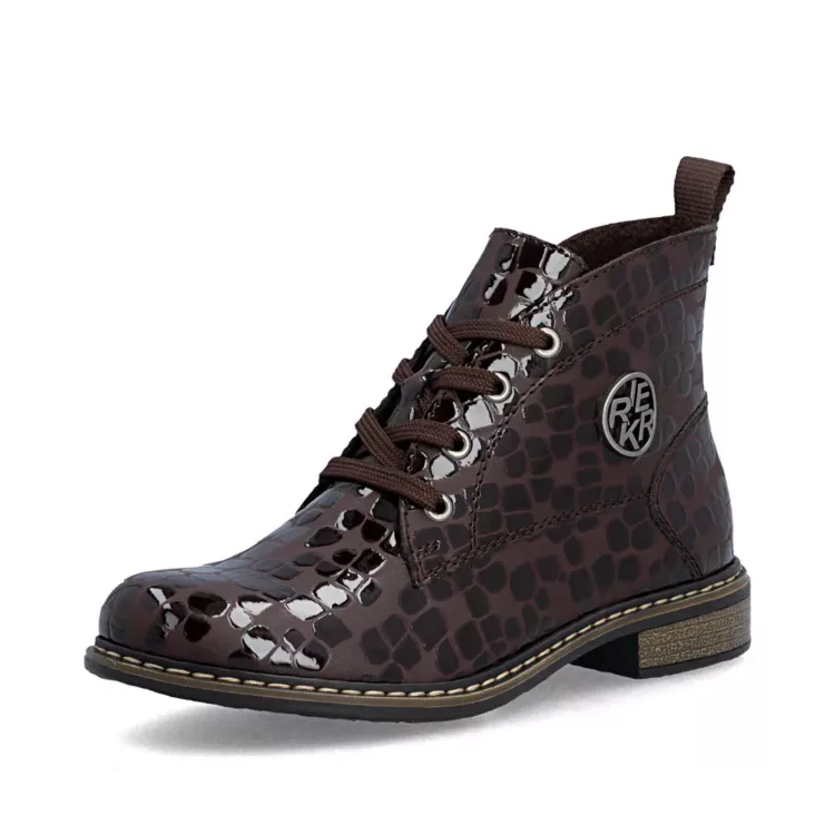Bottines marron vernies de la marque Rieker pour femme. Référence : 71205-25 Marron. Disponible chez Chauss'Family magasin de chaussures à Issoire.