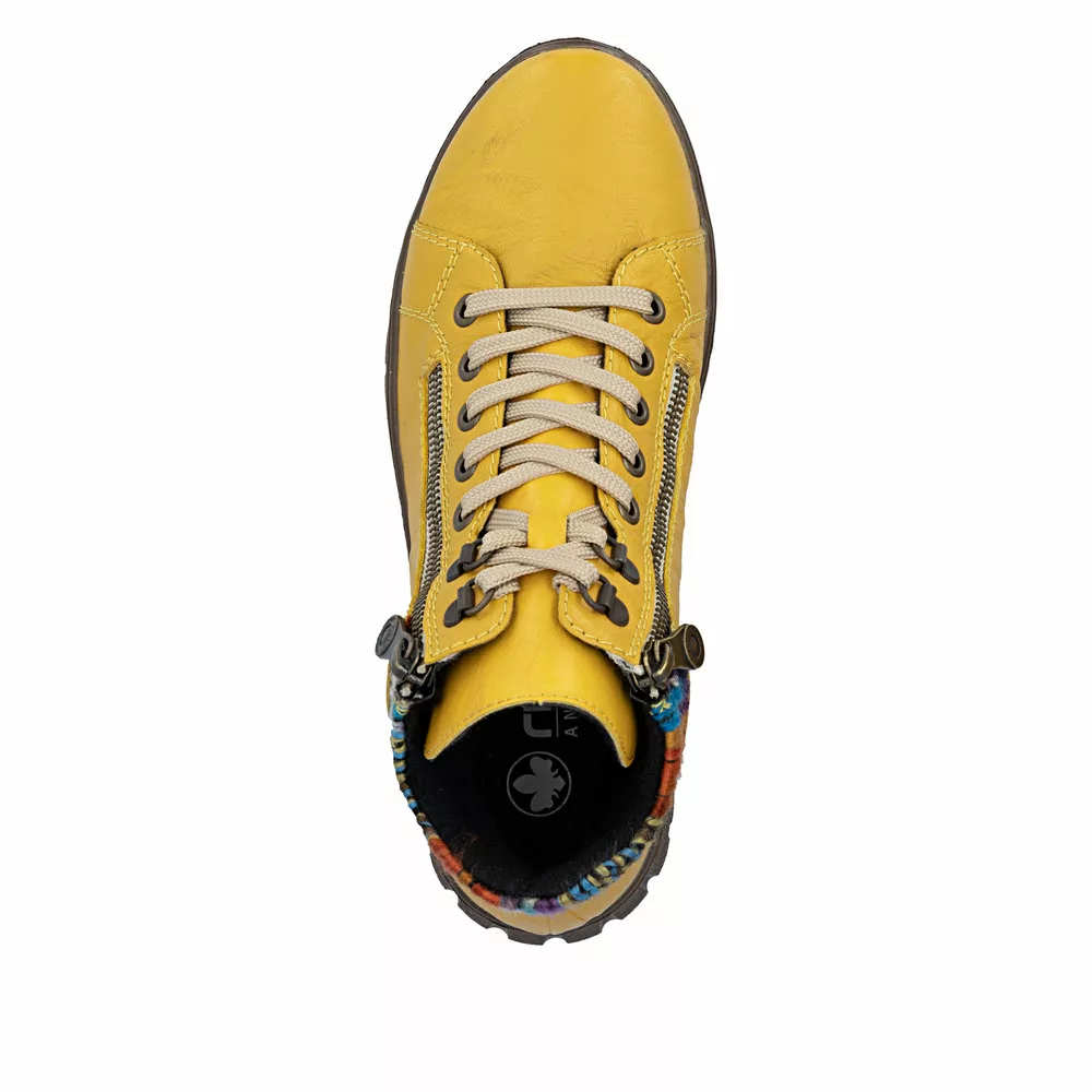 Baskets montantes jaunes de la marque Rieker. Référence : N1305-68 Jaune. Disponible chez Chauss'Family magasin de chaussures à Issoire.