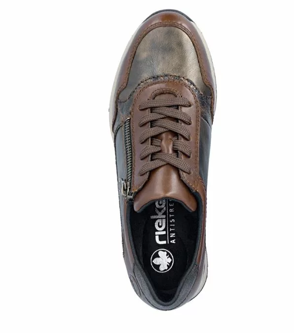 Baskets marron compensées Rieker pour femme. Référence : N9301-27 Marron . Disponible chez Chauss'Family magasin de chaussures à Issoire.