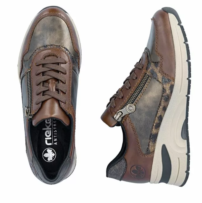 Baskets marron compensées Rieker pour femme. Référence : N9301-27 Marron . Disponible chez Chauss'Family magasin de chaussures à Issoire.